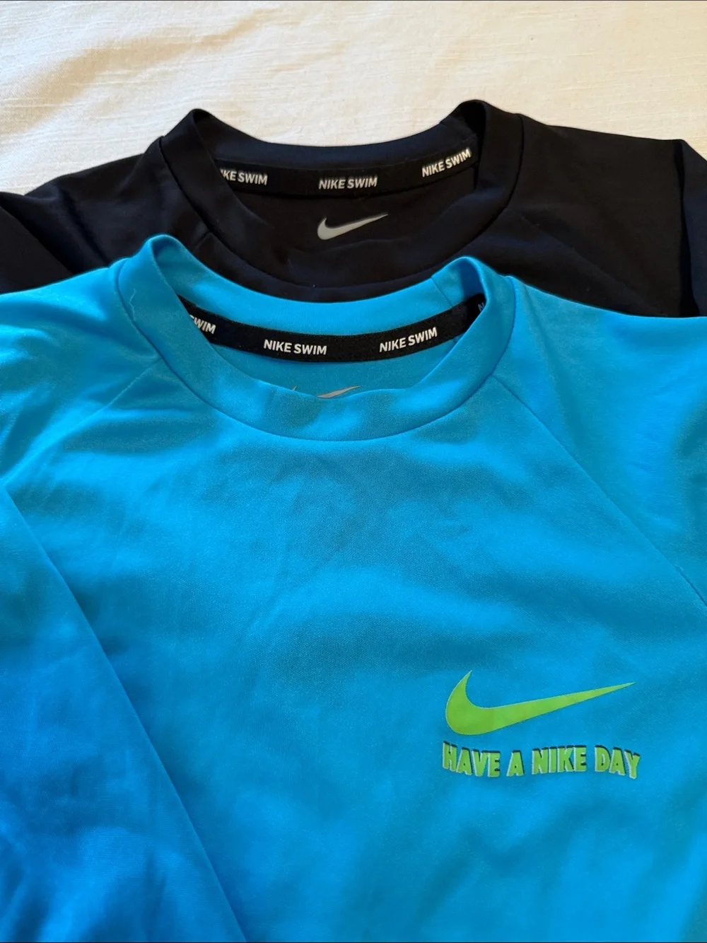 Two sets, Nike rash guard/swim shorts, size small (boys 8-10)